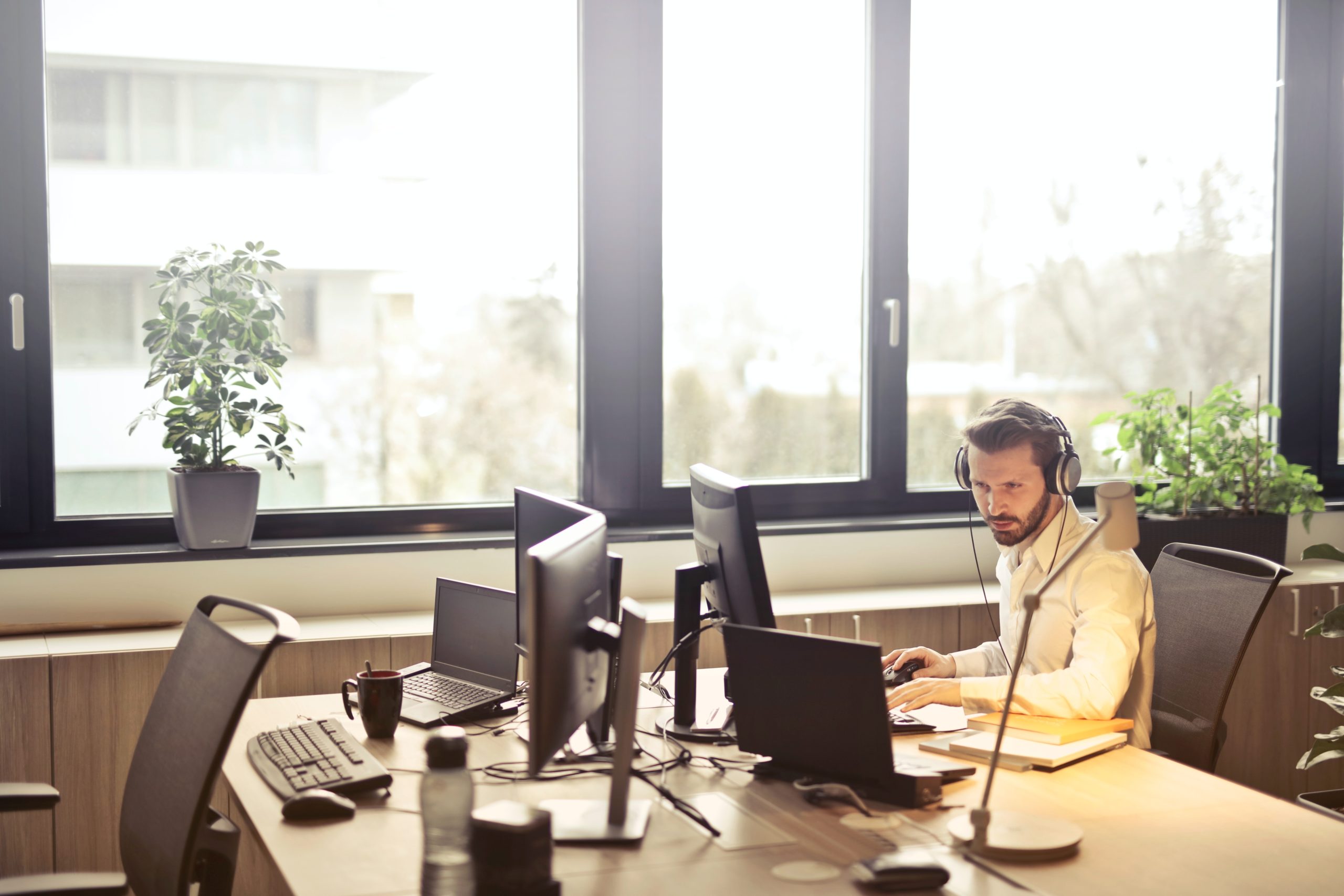 Man at computer doing technology implementation for banks
